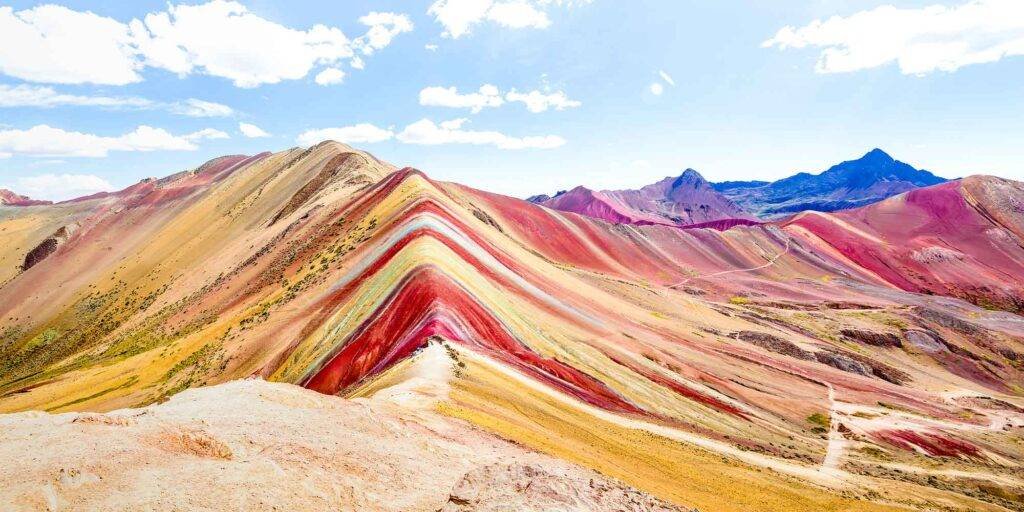 Bright and sunny view of Rainbow Mountain in Peru